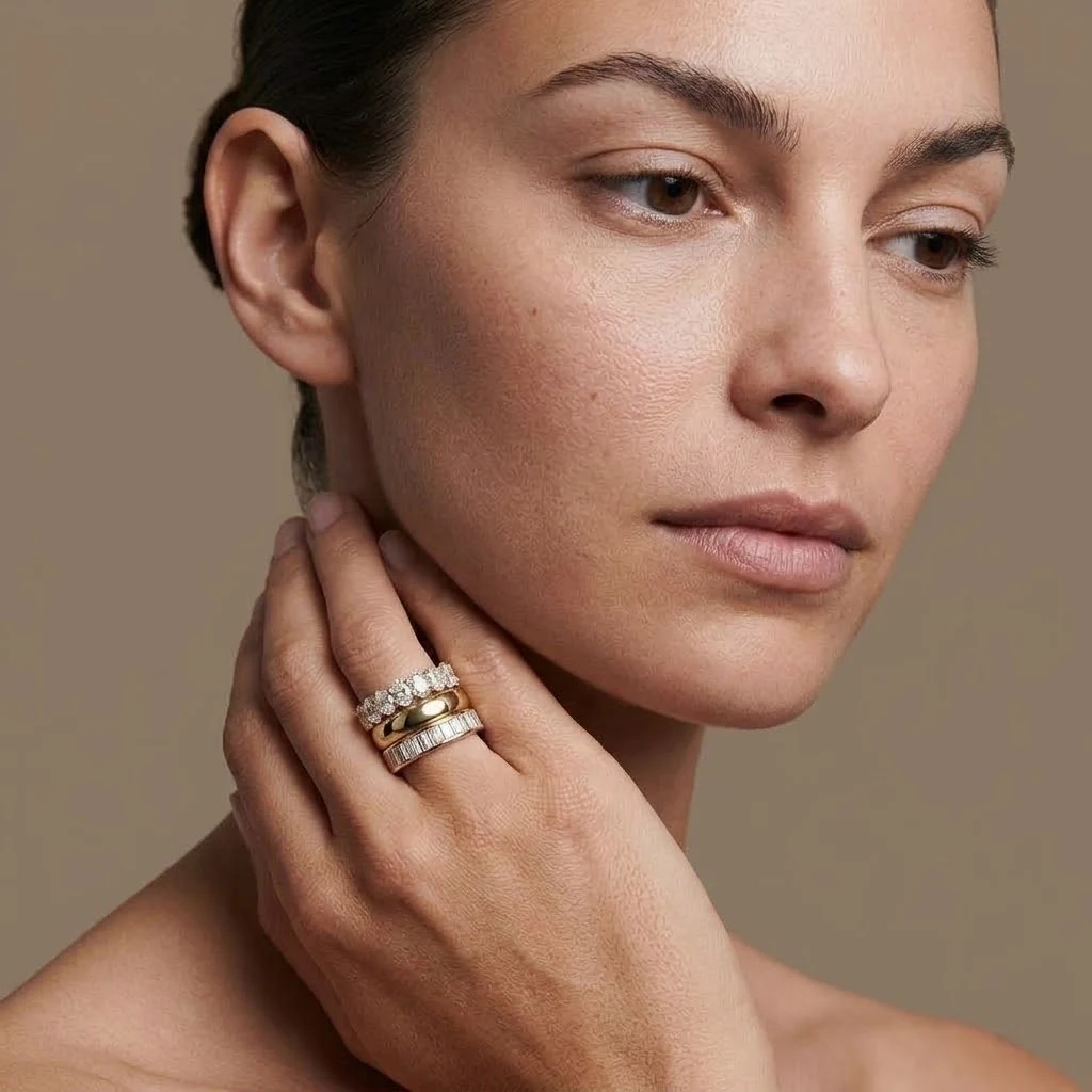 Stacked diamond and gold wedding bands worn on the hand