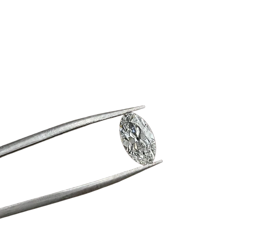 Oval diamond held in tweezers